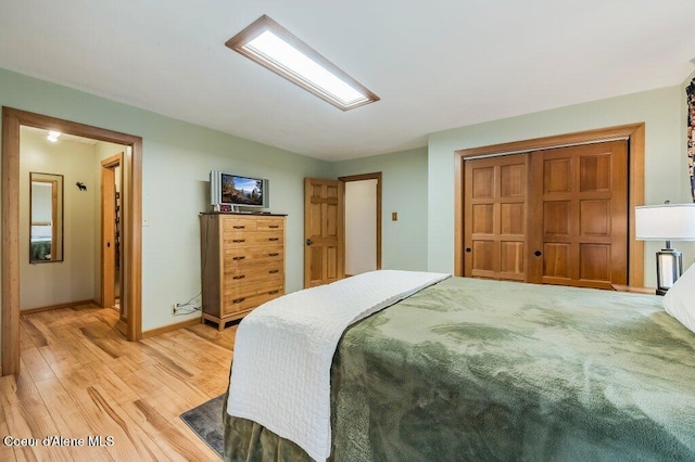 521 Shady Pines Loop, Priest Lake, ID 83856 - bedroom featuring light wood-style flooring, baseboards, and a closet
