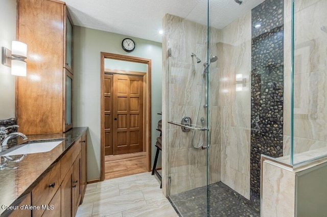 521 Shady Pines Loop, Priest Lake, ID 83856 - full bath with a walk in shower, vanity, and marble look tiles