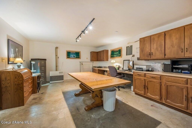 521 Shady Pines Loop, Priest Lake, ID 83856 - kitchen featuring concrete floors, brown cabinets, light countertops, and an office area