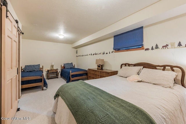 521 Shady Pines Loop, Priest Lake, ID 83856 - bedroom with a barn door and carpet