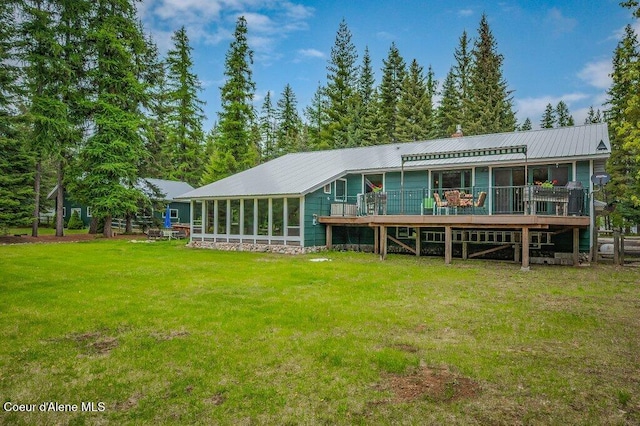 521 Shady Pines Loop, Priest Lake, ID 83856 - rear view of property with a wooden deck, a yard, and metal roof