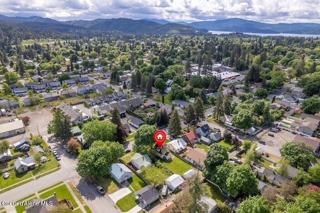 1315 N 7th St, Coeur Dalene, ID 83814 - aerial view of property and surrounding area with mountains and nearby suburban area