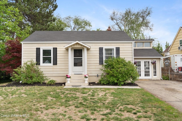 131 Ord Blvd, Nampa, ID 83686 - view of front of house with french doors, entry steps, and a chimney