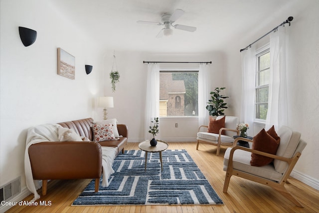 131 Ord Blvd, Nampa, ID 83686 - living room featuring hardwood / wood-style flooring, ceiling fan, and baseboards