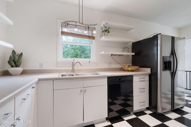 131 Ord Blvd, Nampa, ID 83686 - kitchen with black dishwasher, light floors, a sink, white cabinetry, and stainless steel fridge