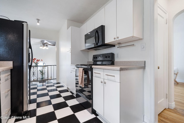131 Ord Blvd, Nampa, ID 83686 - kitchen with black appliances, a ceiling fan, tile patterned floors, light countertops, and white cabinets