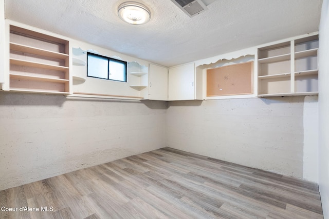 131 Ord Blvd, Nampa, ID 83686 - below grade area with a textured ceiling and light wood-type flooring