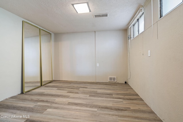 131 Ord Blvd, Nampa, ID 83686 - basement featuring a textured ceiling and wood finished floors