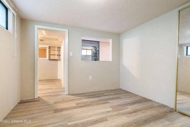 131 Ord Blvd, Nampa, ID 83686 - unfurnished room featuring light wood-style flooring and a textured ceiling