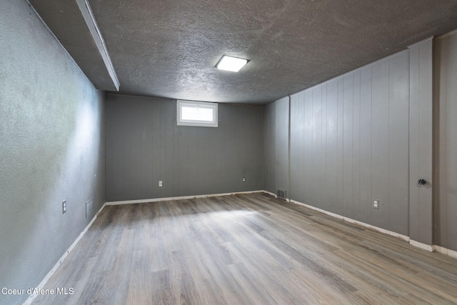 131 Ord Blvd, Nampa, ID 83686 - unfurnished room with wood finished floors, baseboards, and a textured ceiling