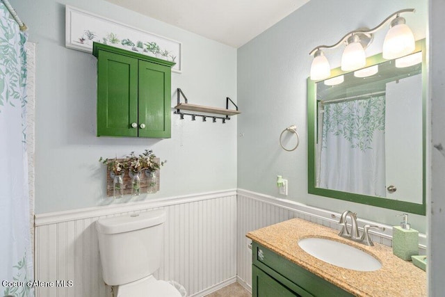 204 Sunrise Dr, Pinehurst, ID 83850 - full bath featuring a wainscoted wall, toilet, and vanity
