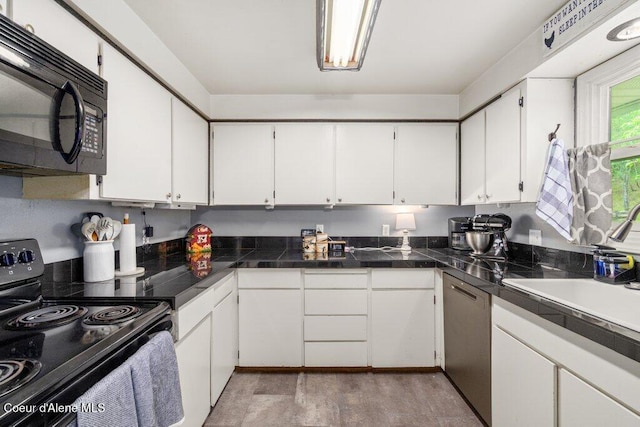 204 Sunrise Dr, Pinehurst, ID 83850 - kitchen featuring range with electric cooktop, black microwave, dishwasher, and white cabinetry