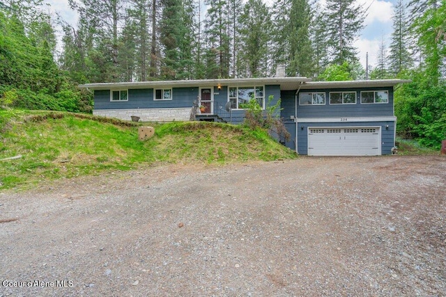 204 Sunrise Dr, Pinehurst, ID 83850 - ranch-style house with dirt driveway, a garage, and a chimney