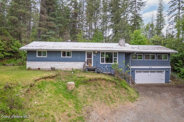 204 Sunrise Dr, Pinehurst, ID 83850 - ranch-style home with an attached garage, a chimney, asphalt driveway, and a front lawn