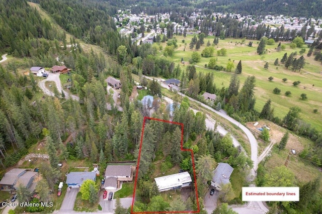 204 Sunrise Dr, Pinehurst, ID 83850 - aerial view of residential area featuring a heavily wooded area and property boundaries highlighted