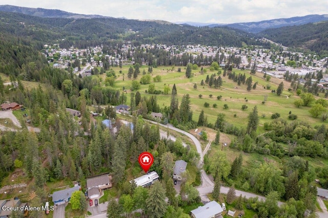 204 Sunrise Dr, Pinehurst, ID 83850 - aerial view of property's location featuring a mountainous background, a forest, and nearby suburban area