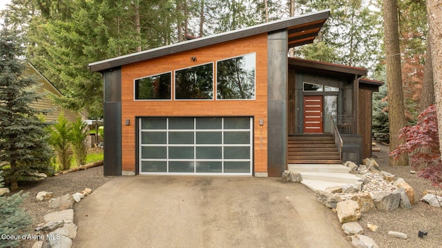 11679 N Avondale Loop, Hayden, ID 83835 - contemporary home featuring driveway and an attached garage