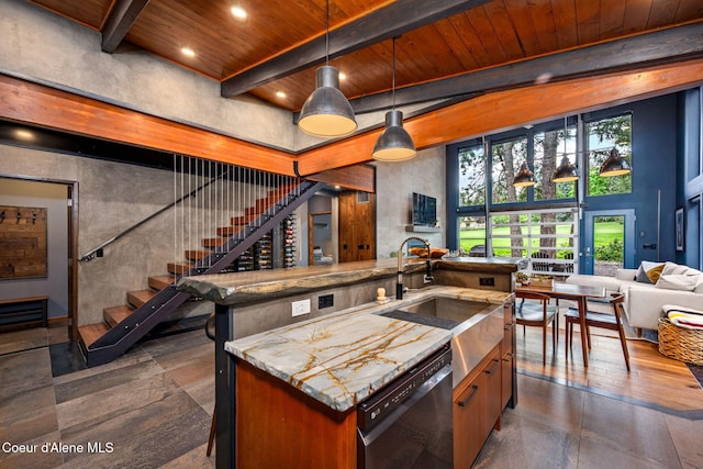 11679 N Avondale Loop, Hayden, ID 83835 - kitchen with dishwasher, open floor plan, wooden ceiling, a sink, and beam ceiling