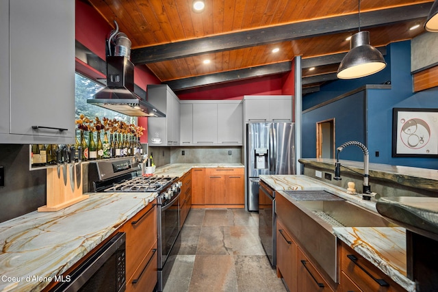11679 N Avondale Loop, Hayden, ID 83835 - kitchen featuring stainless steel appliances, stone finish floors, wall chimney range hood, decorative backsplash, and beam ceiling