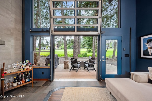11679 N Avondale Loop, Hayden, ID 83835 - doorway to outside with tile walls and a high ceiling