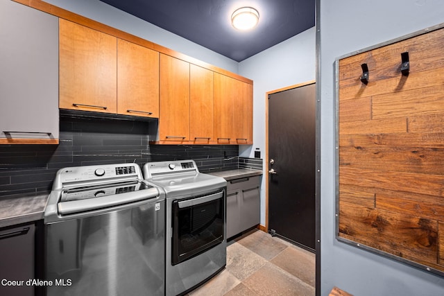 11679 N Avondale Loop, Hayden, ID 83835 - washroom featuring cabinet space and washing machine and clothes dryer
