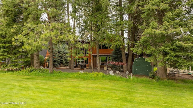 11679 N Avondale Loop, Hayden, ID 83835 - view of grassy yard with a shed and an outbuilding