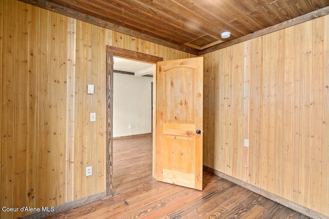 707 Washington Ave, Sandpoint, ID 83864 - unfurnished room with wooden walls, wood finished floors, and wood ceiling
