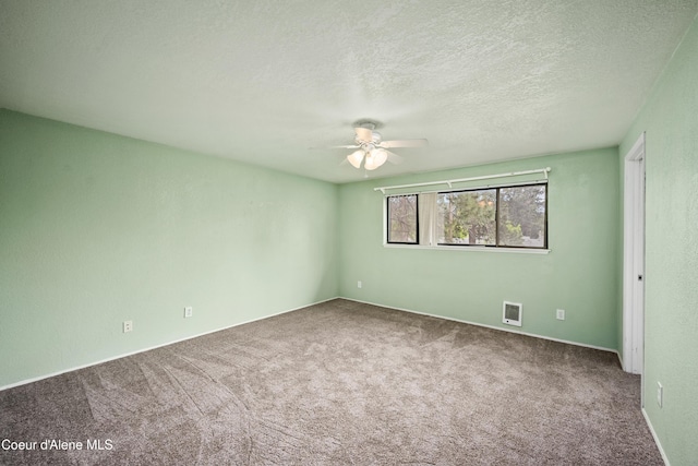 1706 E Thomas Ln, Coeur Dalene, ID 83815 - spare room with a ceiling fan, carpet floors, and a textured ceiling