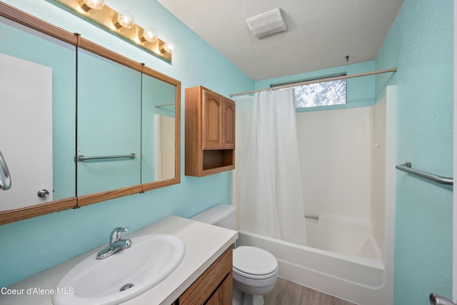 1706 E Thomas Ln, Coeur Dalene, ID 83815 - bathroom with toilet, a textured ceiling, shower / bath combo with shower curtain, vanity, and wood finished floors