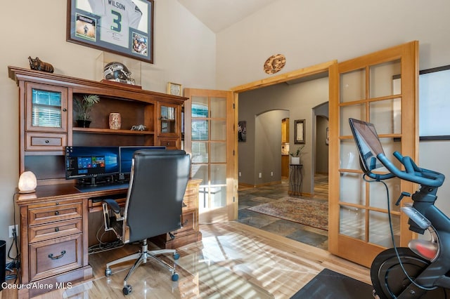 office with arched walkways and high vaulted ceiling