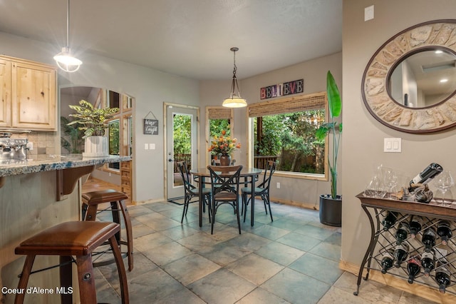 dining room with baseboards