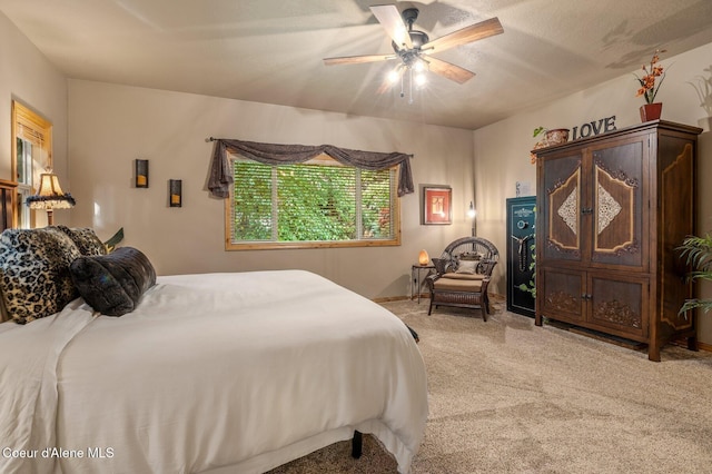 bedroom featuring light carpet and a ceiling fan