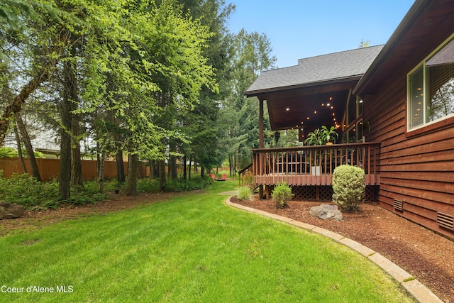 view of yard featuring a deck