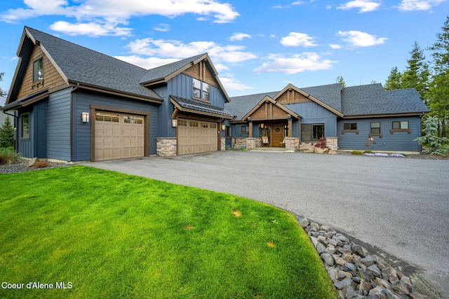 1230 E Amulet Cir, Rathdrum, ID 83858 - craftsman-style house with board and batten siding, driveway, a shingled roof, and a front lawn