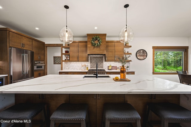 1230 E Amulet Cir, Rathdrum, ID 83858 - kitchen with open shelves, stainless steel appliances, a sink, decorative backsplash, and light stone countertops