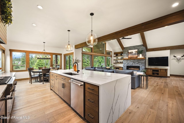 1230 E Amulet Cir, Rathdrum, ID 83858 - kitchen featuring a sink, a stone fireplace, plenty of natural light, light wood finished floors, and recessed lighting