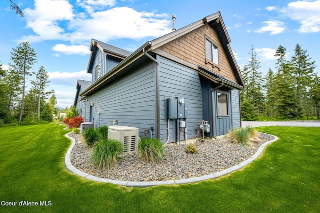 1230 E Amulet Cir, Rathdrum, ID 83858 - view of side of property featuring a lawn, central AC, and a cooling unit