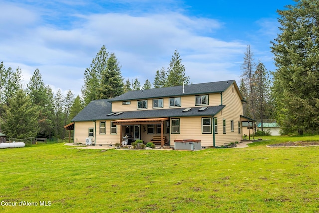 27464 N Timber Ridge Rd, Rathdrum, ID 83858 - back of house featuring a hot tub and a patio area