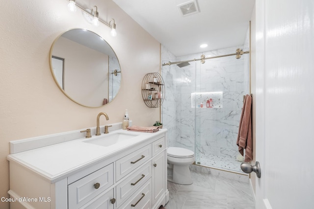 27464 N Timber Ridge Rd, Rathdrum, ID 83858 - full bath featuring marble look tile flooring, a marble finish shower, toilet, vanity, and recessed lighting