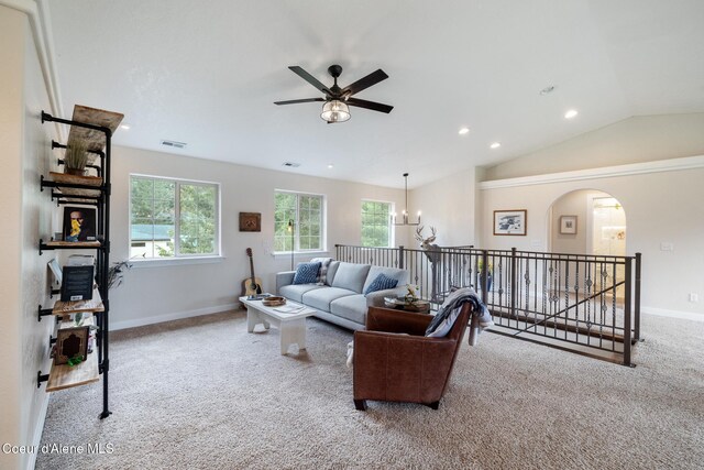 27464 N Timber Ridge Rd, Rathdrum, ID 83858 - carpeted living room featuring a ceiling fan, recessed lighting, arched walkways, baseboards, and lofted ceiling