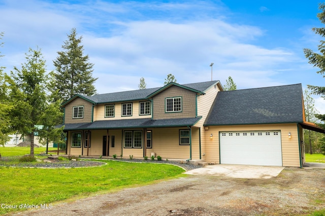 27464 N Timber Ridge Rd, Rathdrum, ID 83858 - view of front facade with driveway, a garage, a front yard, and a porch