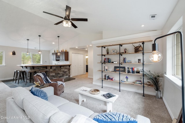 27464 N Timber Ridge Rd, Rathdrum, ID 83858 - living area with light carpet, lofted ceiling, ceiling fan, baseboards, and a chandelier