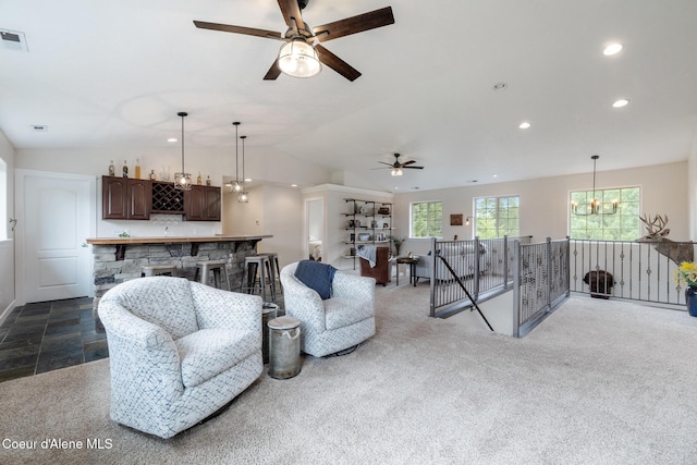27464 N Timber Ridge Rd, Rathdrum, ID 83858 - living room featuring recessed lighting, vaulted ceiling, a ceiling fan, bar, and a chandelier