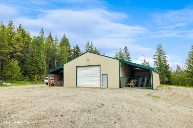 27464 N Timber Ridge Rd, Rathdrum, ID 83858 - garage featuring dirt driveway and a garage