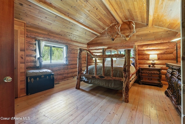 bedroom with wooden ceiling, light wood finished floors, and rustic walls