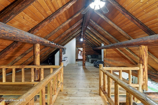 hallway with an upstairs landing, wooden ceiling, and wood-type flooring