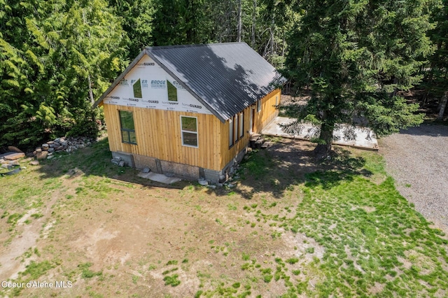 view of side of property featuring metal roof