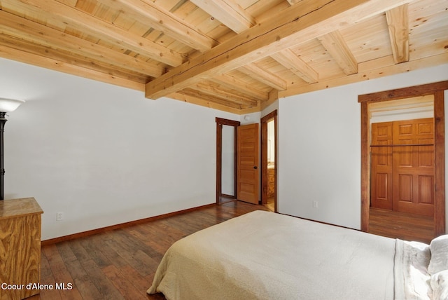 bedroom with beamed ceiling, wood ceiling, hardwood / wood-style floors, and baseboards