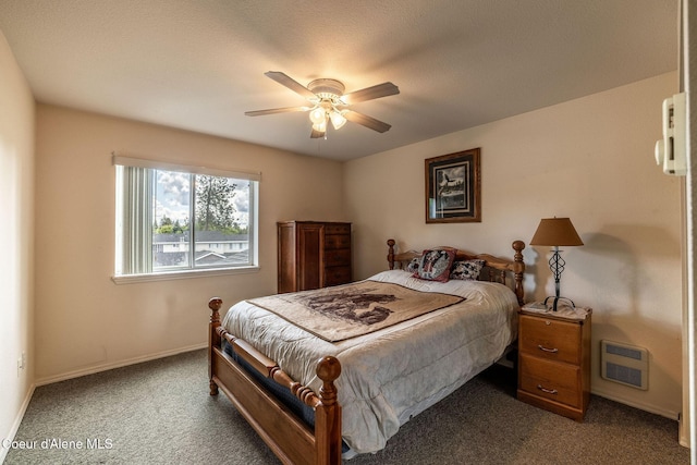377 E Knotty Pine Ln Unit 2, Coeur Dalene, ID 83815 - bedroom featuring dark colored carpet, baseboards, heating unit, and a ceiling fan