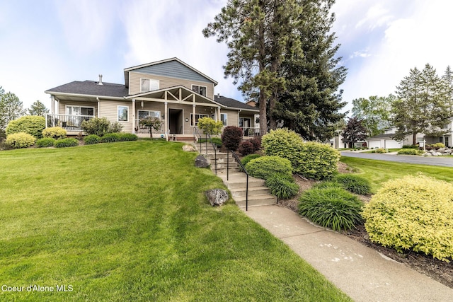377 E Knotty Pine Ln Unit 2, Coeur Dalene, ID 83815 - view of front facade with a front yard and a porch